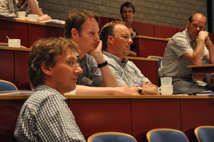 Publiek in de zaal tijdens de discussie